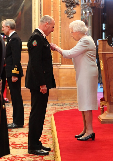 John receiving his Queens Police Medal from Her Majesty the Queen at the Medal Investiture at Windsor Castle